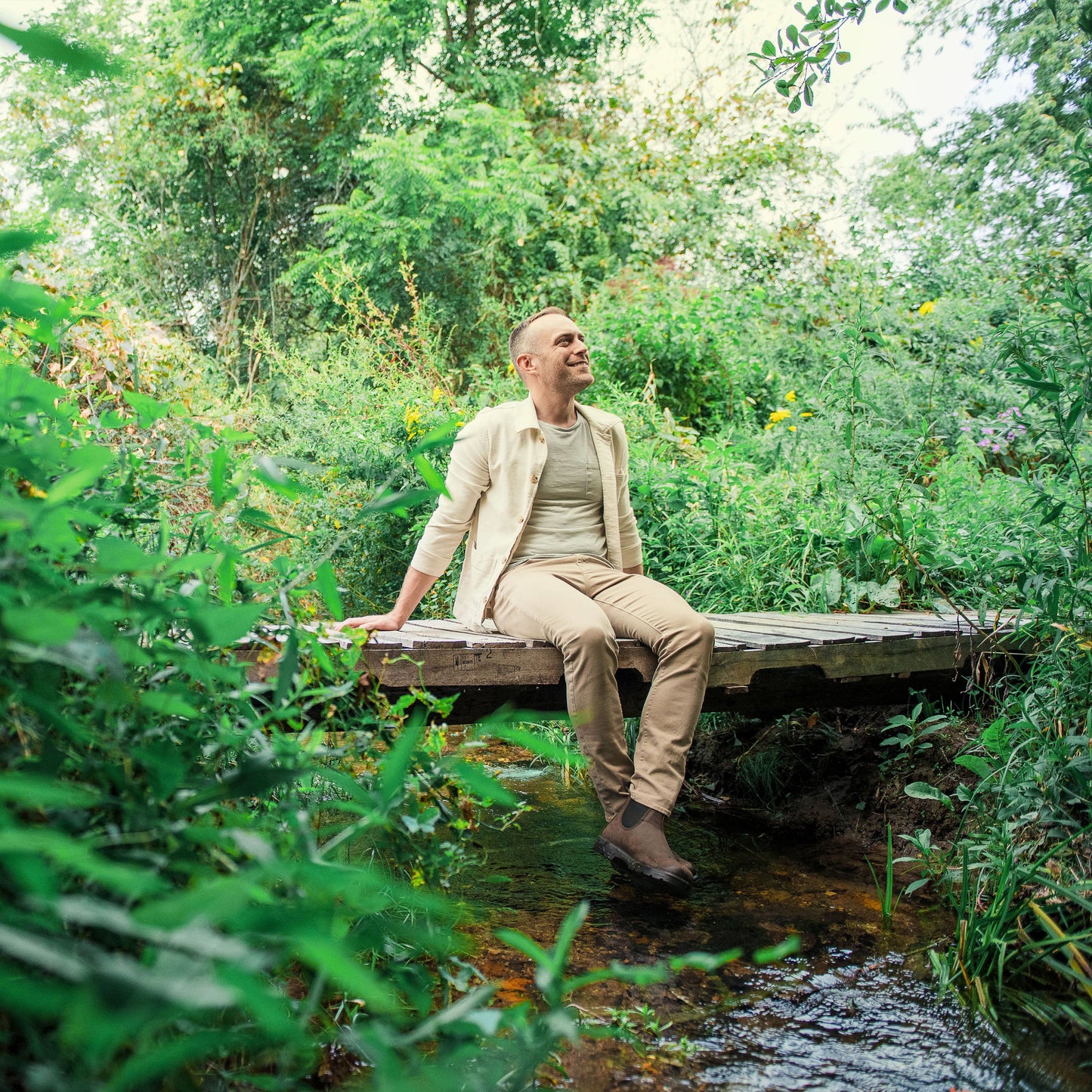Person Sitting On Bridge Looking Up At The Sky For Stress Category